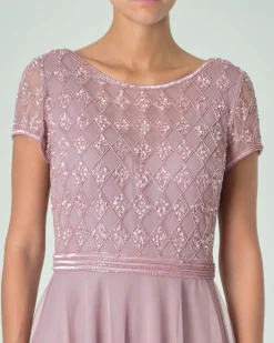 Abito corto rosa tonalità fredda in tulle con ricami in perline tono su tono sul corpetto con maniche ad aletta