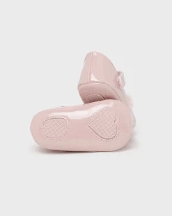 Ballerine in vernice rosa con pompon
