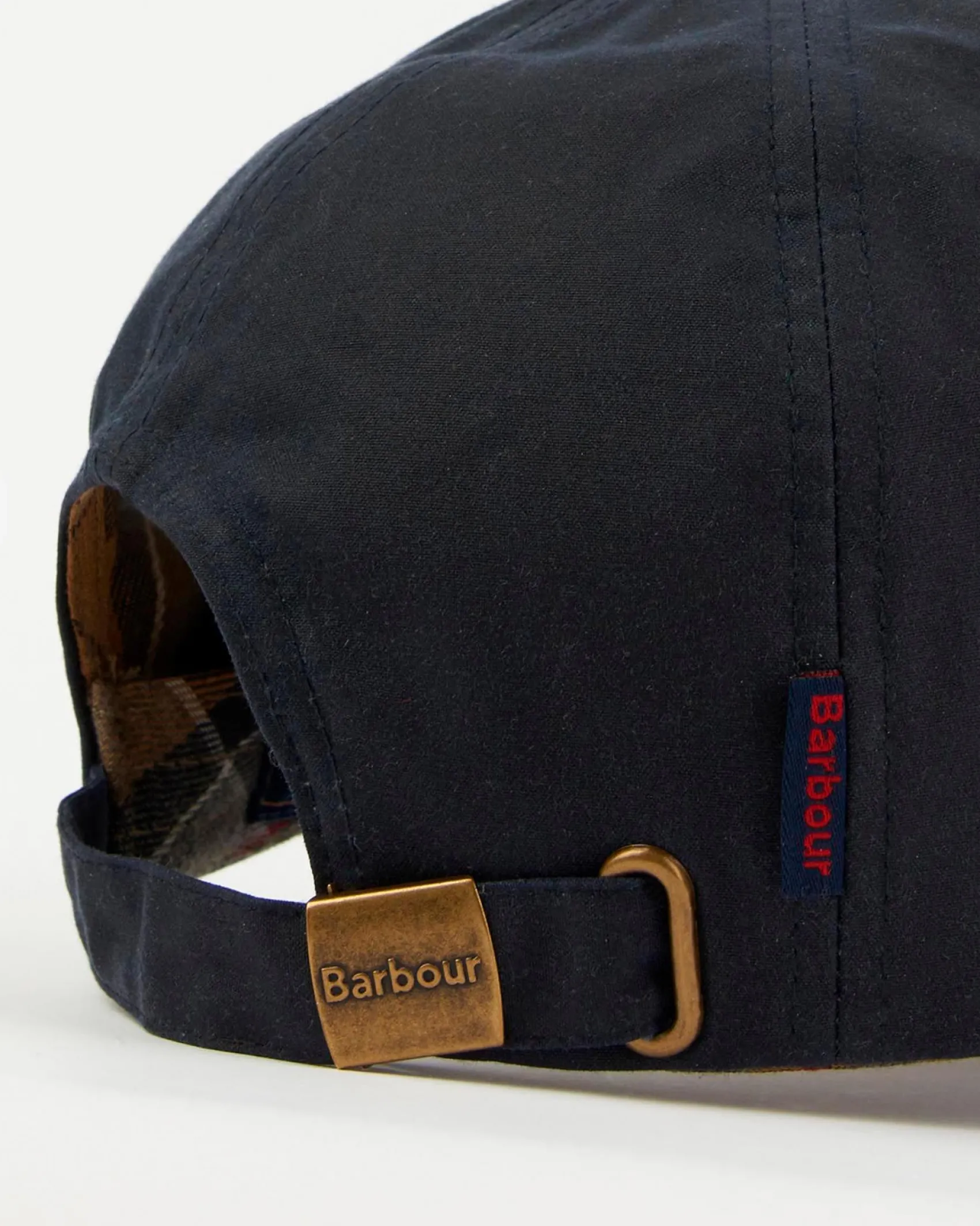 Berretto Barbour blu in cotone cerato con frontino