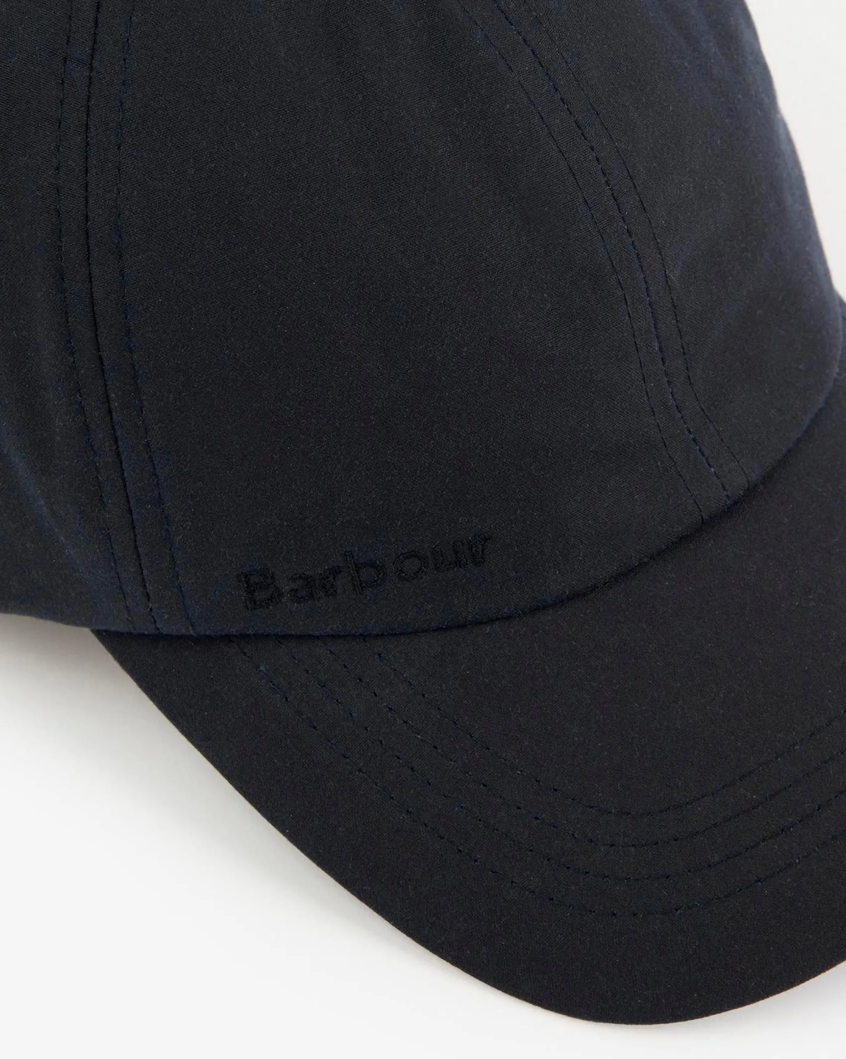 Berretto Barbour blu in cotone cerato con frontino