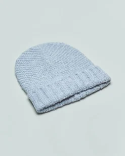 Berretto blu denim in misto lana e viscosa bouclè con risvolto a coste