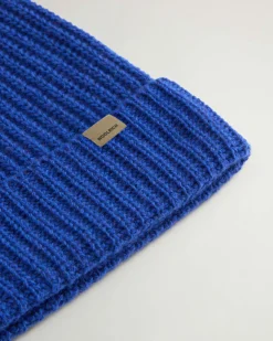 Berretto Woolrich blu royal a coste in lana merino con risvolto e logo