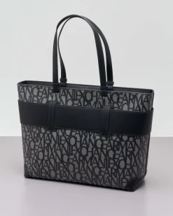 Borsa a mano nera misura piccola in similpelle con scritta gesso logo all over con maxi fibbia logo a specchio tono su tono
