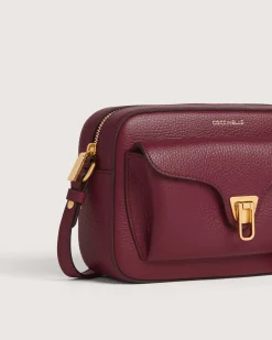 Borsa a tracolla bordeaux Coccinelle Beat Soft Small in pelle con tasca esterna e chiusura a girello