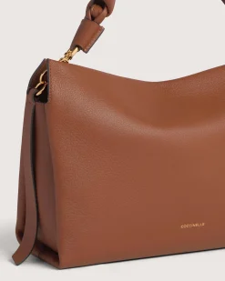 Borsa Coccinelle Boheme Medium in pelle color cognac con manico intrecciato