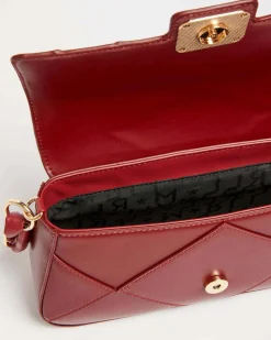 Borsa Emily Marella bordeaux in similpelle liscia a motivo a rilievo a rombi con borchi dorate applicate