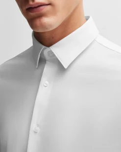 Camicia Boss bianca Hank slim fit in tessuto tecnico stretch con colletto Kent