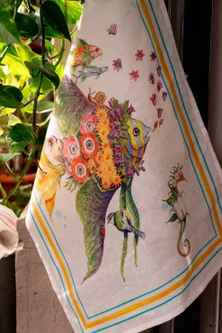Canovaccio Pesciflora in lino bianco con stampa animali adornati di fiori multicolor e contorno giallo e azzurro