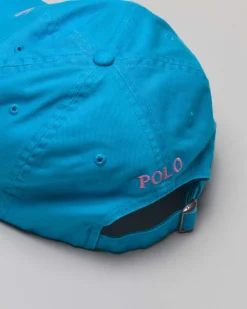 Cappellino turchese in cotone con logo ricamato sul frontino a contrasto di colore