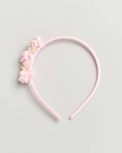 Cerchiello rosa con applicazione floreale
