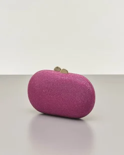 Clutch ovale fucsia con strass applicati all over e chiusura a scatto a sfera
