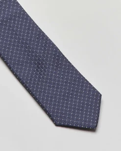Cravatta blu con micro pois bianchi