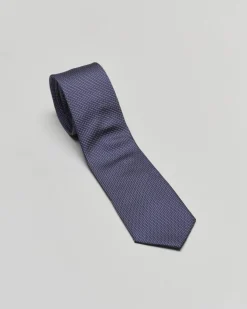 Cravatta blu con micro puntino bianco in pura seta