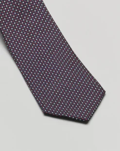 Cravatta blu in fantasia pois bianchi e bordeaux di misto seta e cotone
