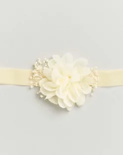 Fascetta color panna con fiore e decorazioni