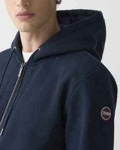 Felpa Colmar Originals blu con cappuccio chiusura zip e logo bollo applicato sulla manica
