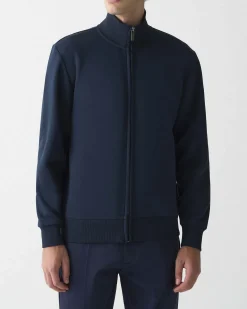 Felpa Colmar Originals blu con chiusura zip e logo bollo applicato sulla manica