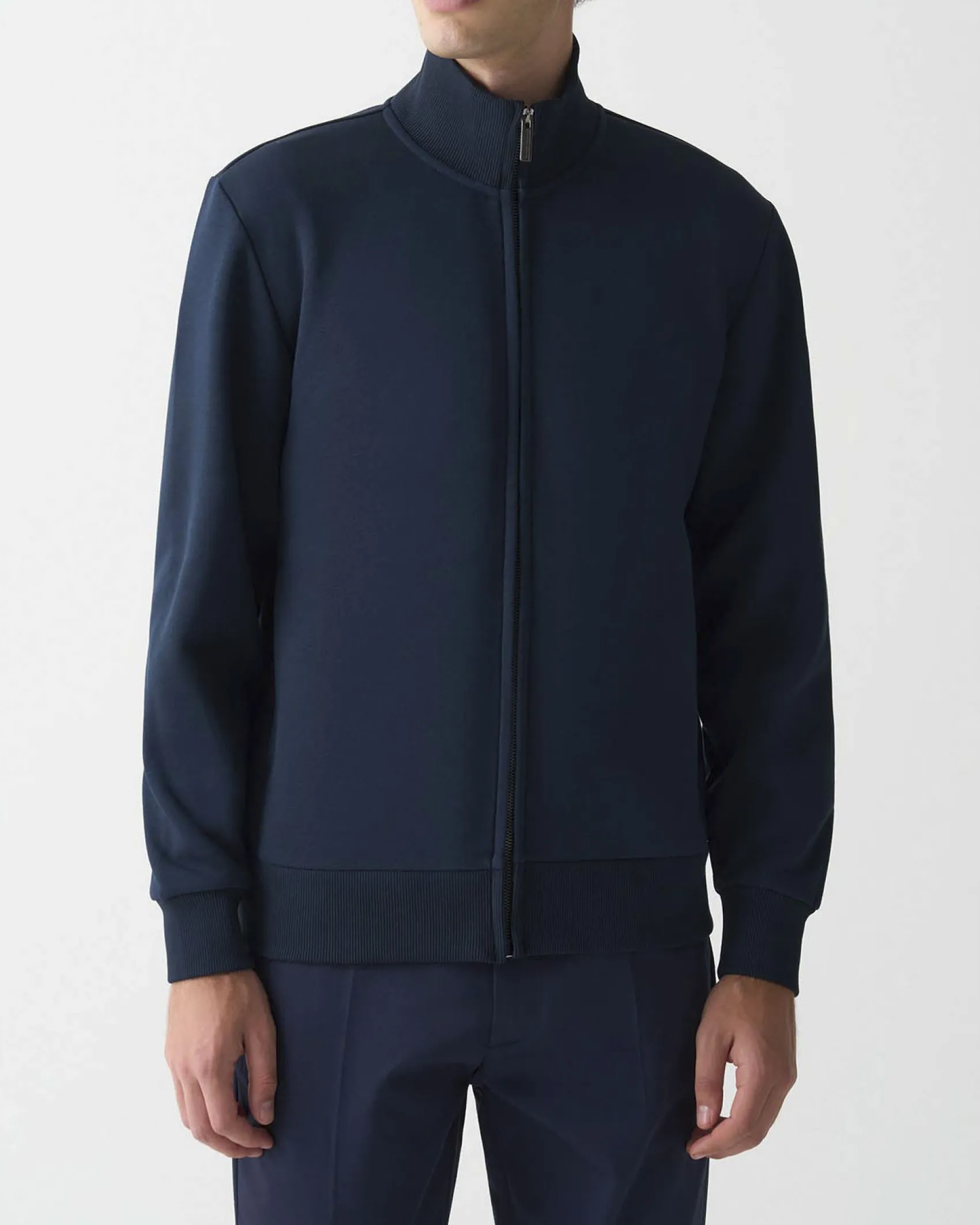 Felpa Colmar Originals blu con chiusura zip e logo bollo applicato sulla manica