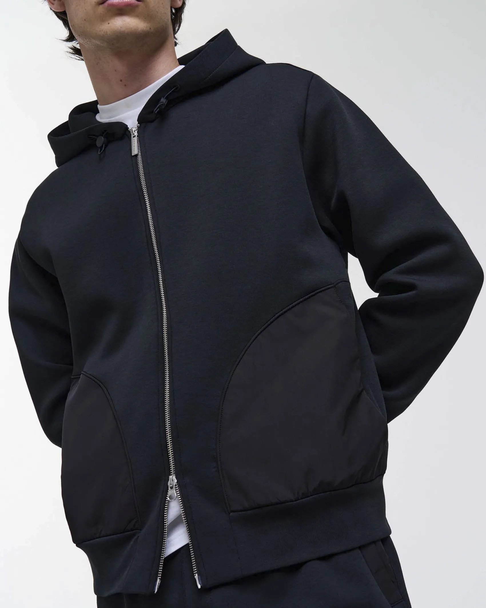 Felpa Colmar Originals nera con cappuccio chiusura zip e tasche in nylon