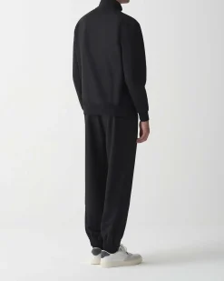 Felpa Colmar Originals nera con chiusura zip e logo bollo applicato sulla manica