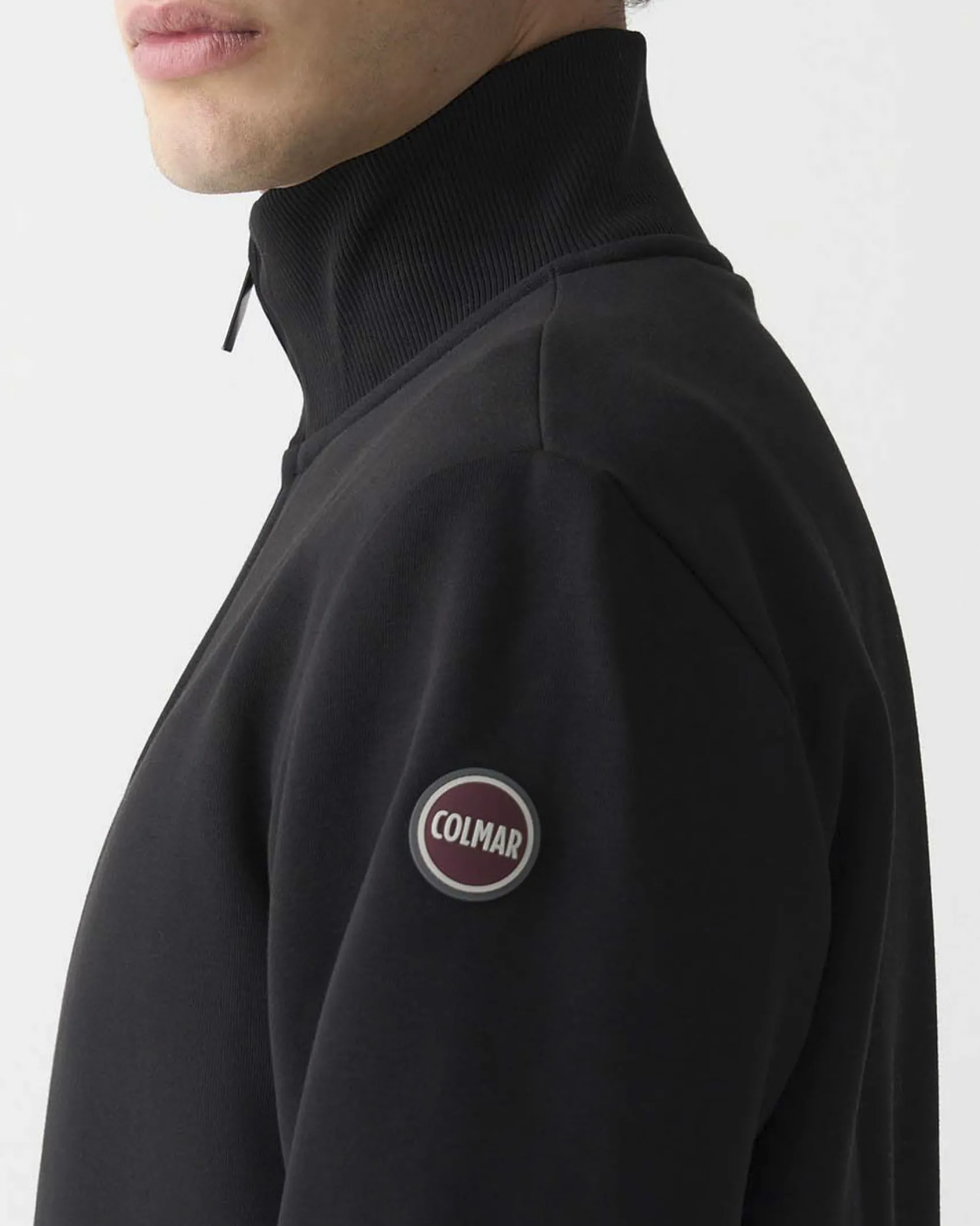 Felpa Colmar Originals nera con chiusura zip e logo bollo applicato sulla manica
