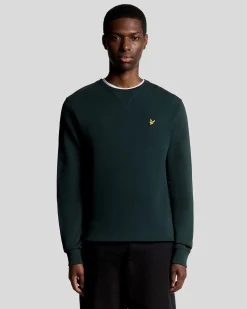 Felpa girocollo Lyle & Scott verde scuro con logo aquila gialla ricamato sul petto