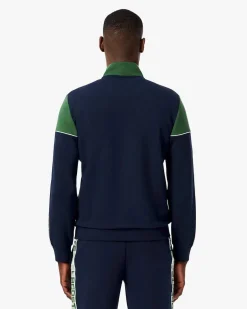Felpa Lacoste color block verde e blu con piping porta logo e chiusura zip