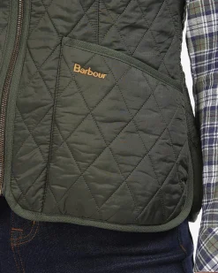 Gilet verde trapuntato dalla linea sfiancata con scollo a V e chiusura a cerniera