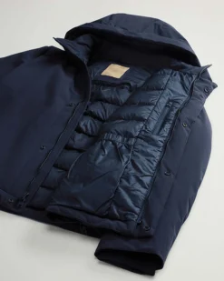Giubbino blu Woolrich in tessuto stretch imbottito in piuma con cappuccio staccabile