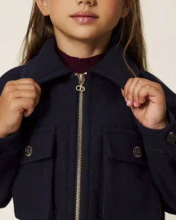 Giubbino cropped Twinset blu in panno con taschine e zip