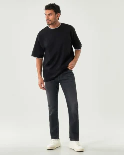 Jeans Boss Delaware slim-fit in cotone stretch lavaggio nero stone washed con leggere baffature