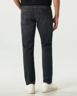 Jeans Boss Delaware slim-fit in cotone stretch lavaggio nero stone washed con leggere baffature