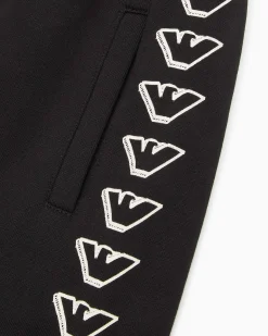 Jogger Emporio Armani in felpa di cotone nera con stampa grafica aquile bianche