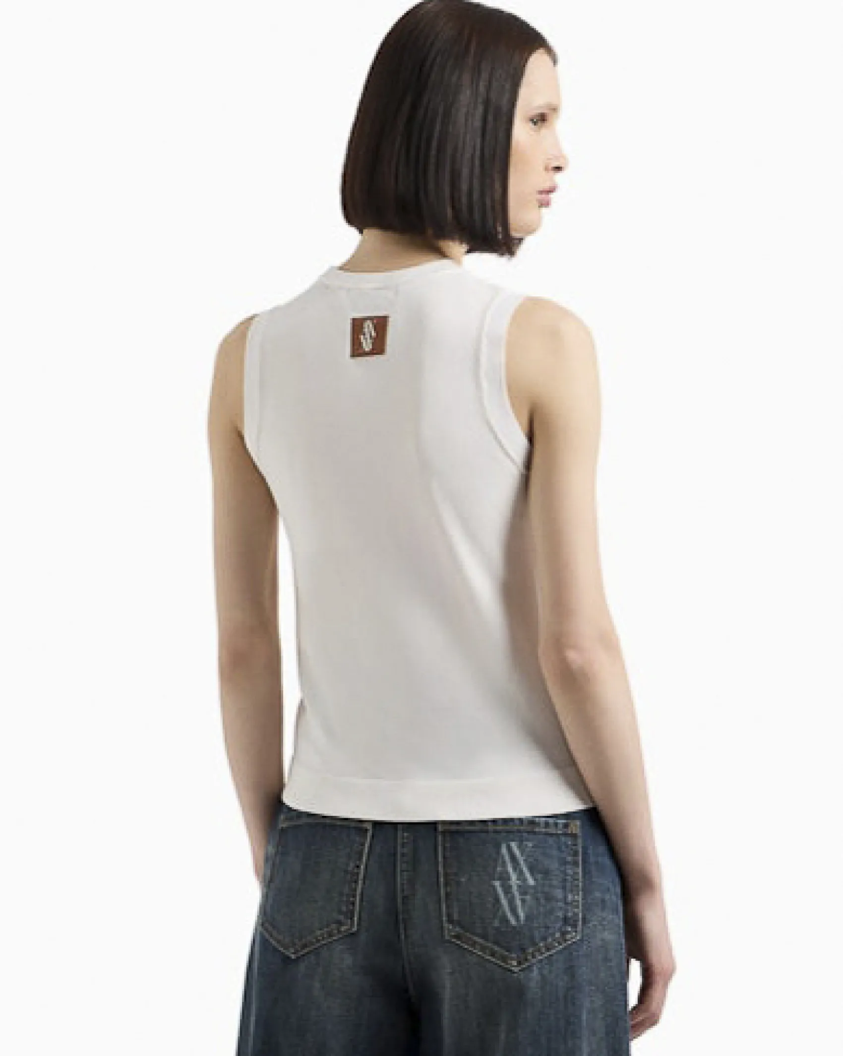 Maglia color latte in misto viscosa stretch senza maniche