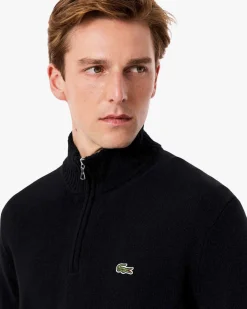 Maglia Lacoste nera in lambswool di pura lana a collo alto e apertura a mezza zip