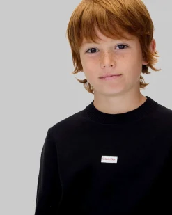 Maglioncino Calvin Klein nero in puro cotone con mini patch logo