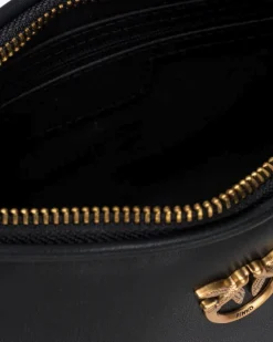Mini Love Bag Half Moon in pelle liscia nera con logo Love Birds dorato in metallo frontale