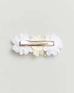 Molletta con fiori panna e bianchi