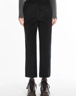 Pantaloni a trombetta neri in velluto millerighe di cotone stretch a vita alta con piega stirata