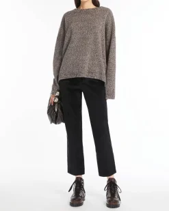 Pantaloni a trombetta neri in velluto millerighe di cotone stretch a vita alta con piega stirata