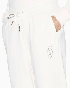Pantaloni Armani Exchange bianchi in cotone con dettagli in maglia