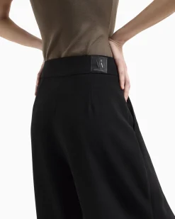 Pantaloni balloon neri ampi in tela con pinces frontali