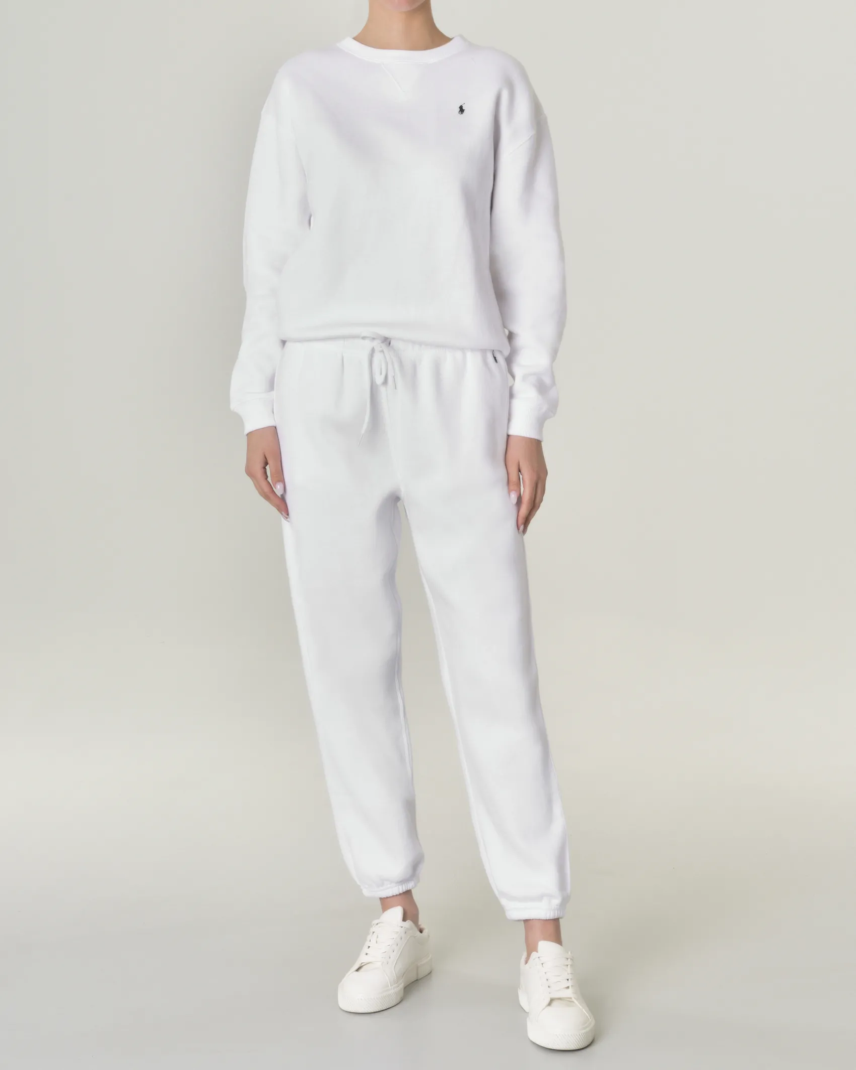 Pantaloni bianchi in felpa di cotone con elastico inserito nei polsini e in vita