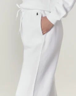 Pantaloni bianchi in felpa di cotone con elastico inserito nei polsini e in vita