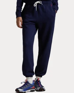 Pantaloni blu in felpa di cotone garzato con elastico al fondo e logo rosso ricamato