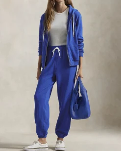 Pantaloni blu royal in felpa di cotone garzato con elastico al fondo e logo rosso ricamato