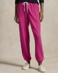 Pantaloni fucsia in felpa di cotone garzato con elastico al fondo e logo blu ricamato