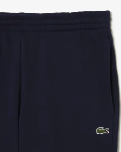 Pantaloni Lacoste blu in felpa di cotone con logo coccodrillo verde sul fianco