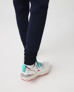Pantaloni Lacoste blu in felpa di cotone con logo coccodrillo verde sul fianco