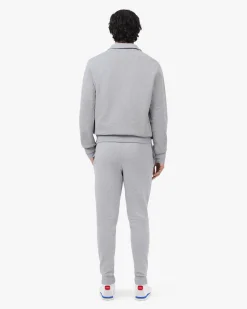 Pantaloni Lacoste grigi in felpa di cotone con logo coccodrillo verde sul fianco